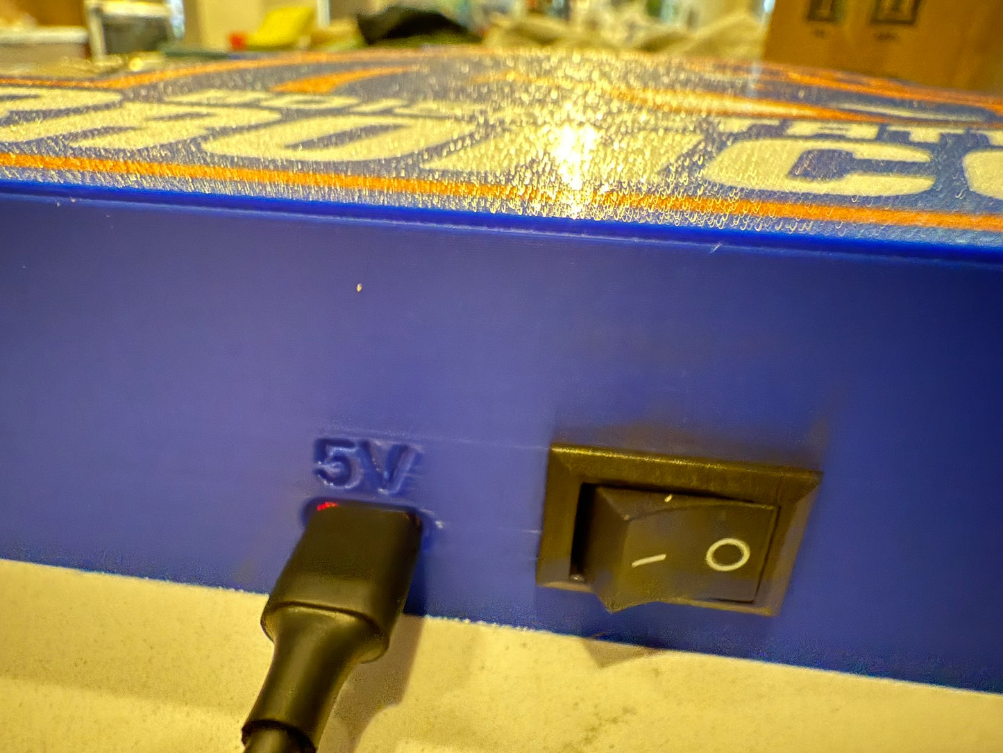 a close up of a blue box with a black handle