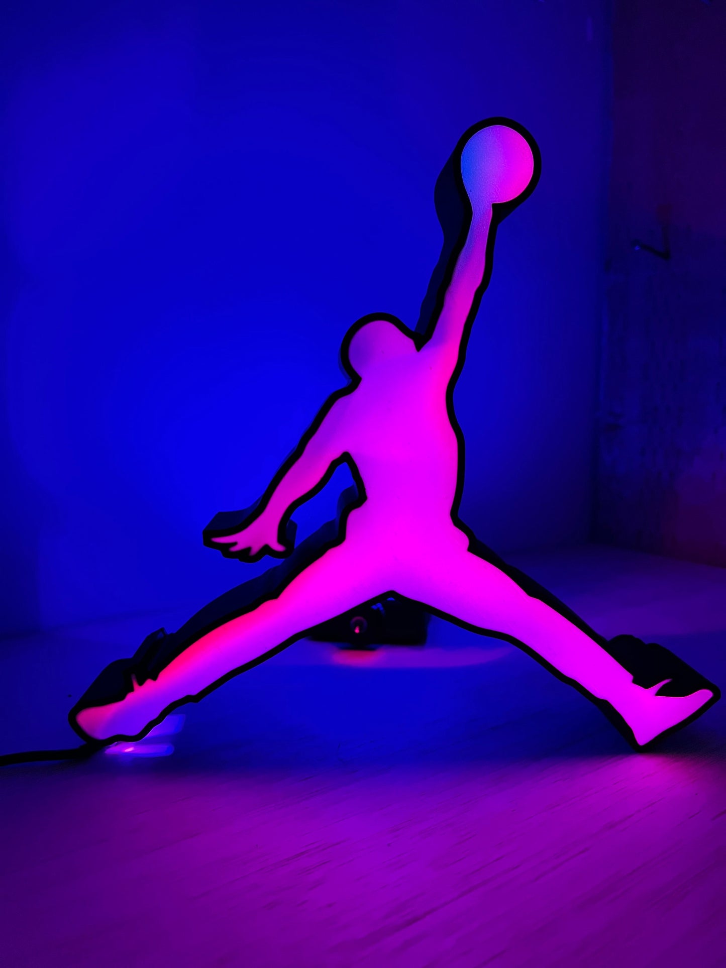 a purple and black picture of a person doing a trick on a skateboard