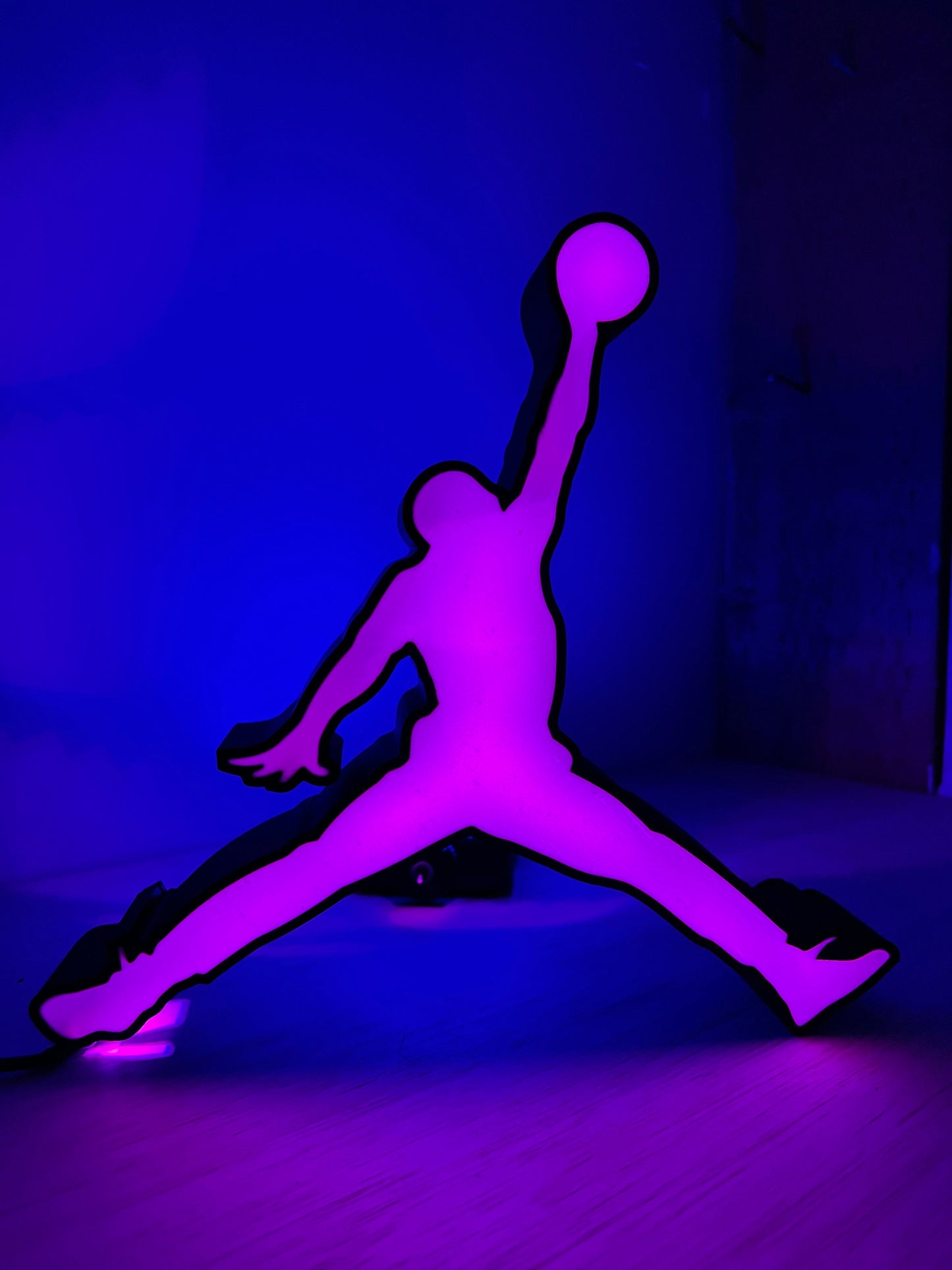 a purple and black picture of a person on a skateboard