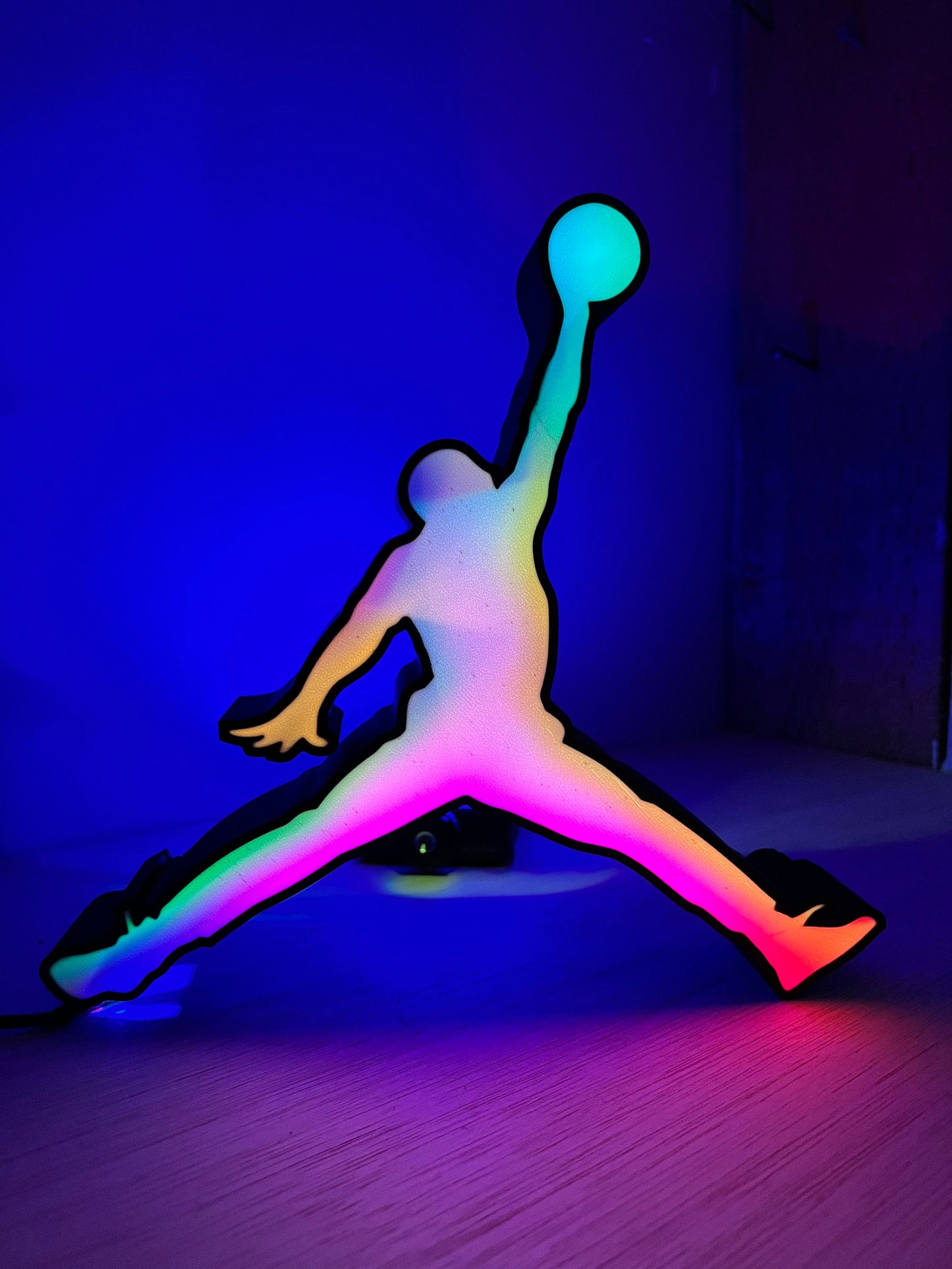 a person jumping up into the air with a ball in their hand