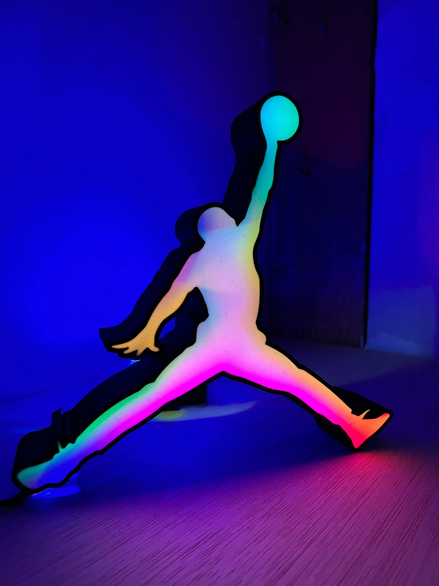 a person standing in a room with a ball in their hand