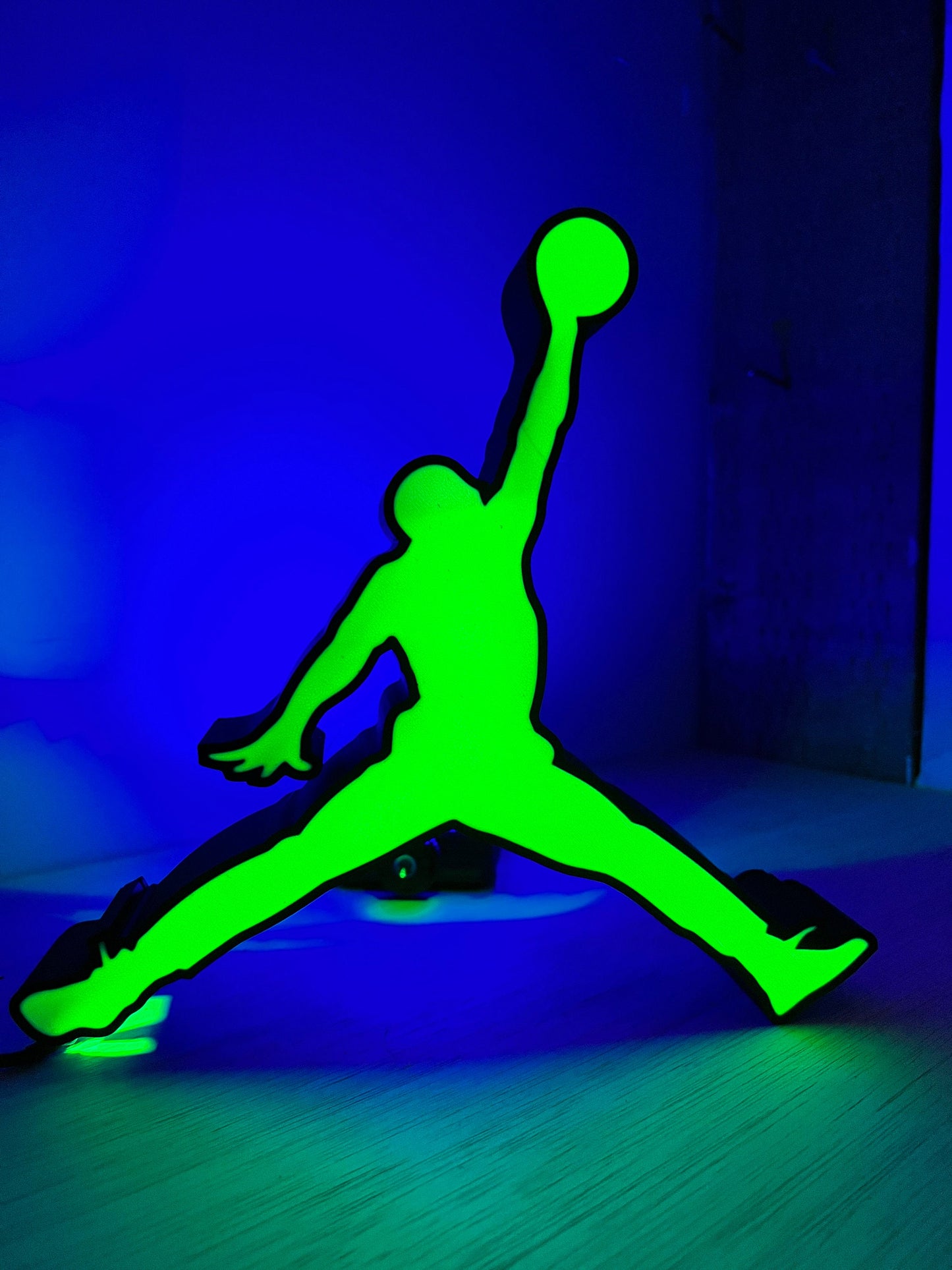 a green and black picture of a person on a skateboard