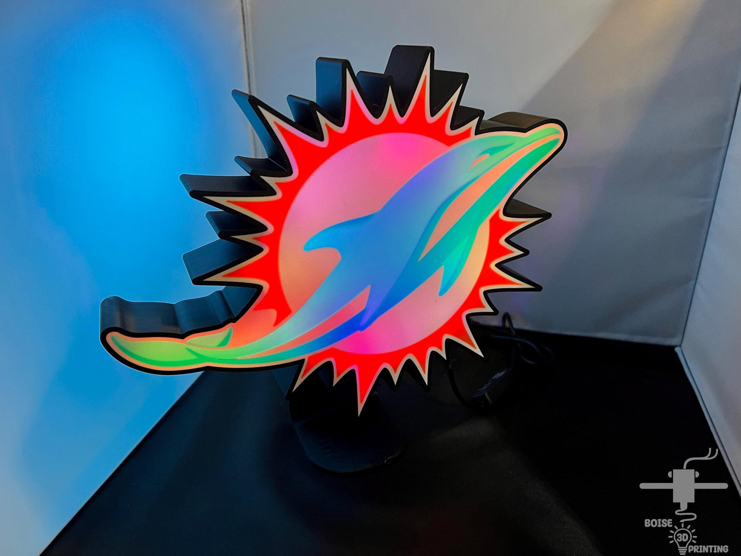 a picture of a sun and a fish on a table