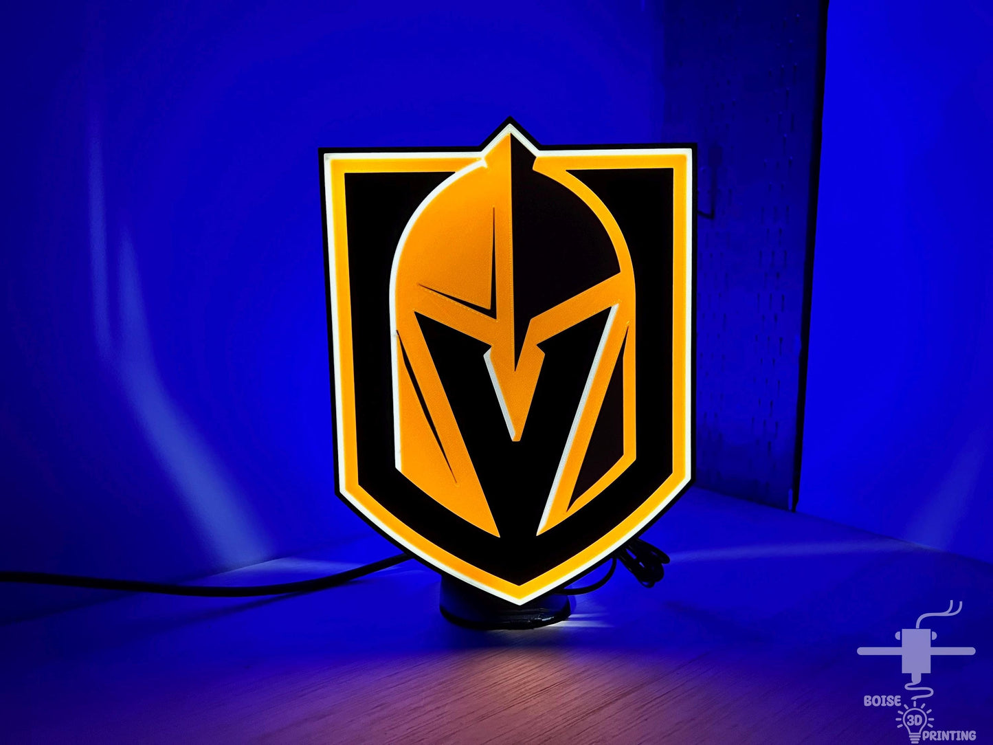 a yellow and black logo on a blue background
