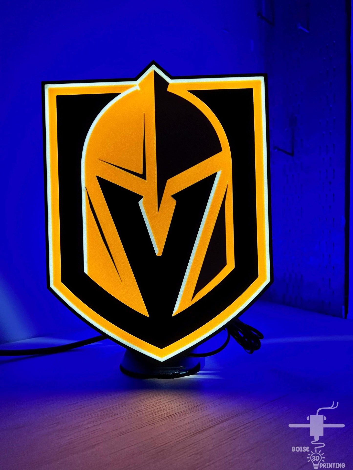 a yellow and black logo on a blue background