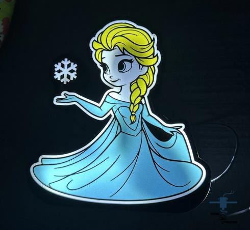 a picture of a frozen princess in a blue dress