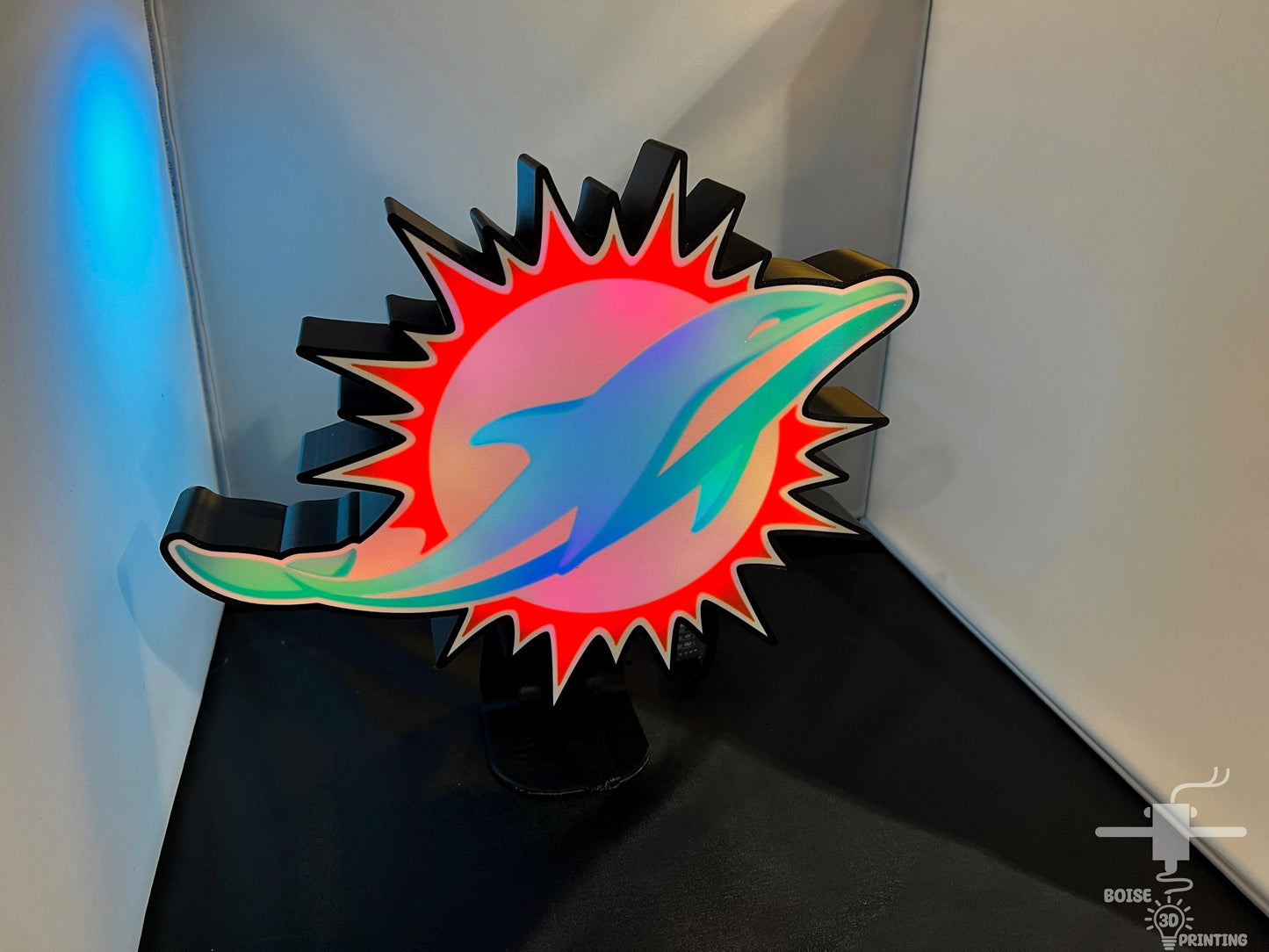 a sculpture of a dolphin on a black table