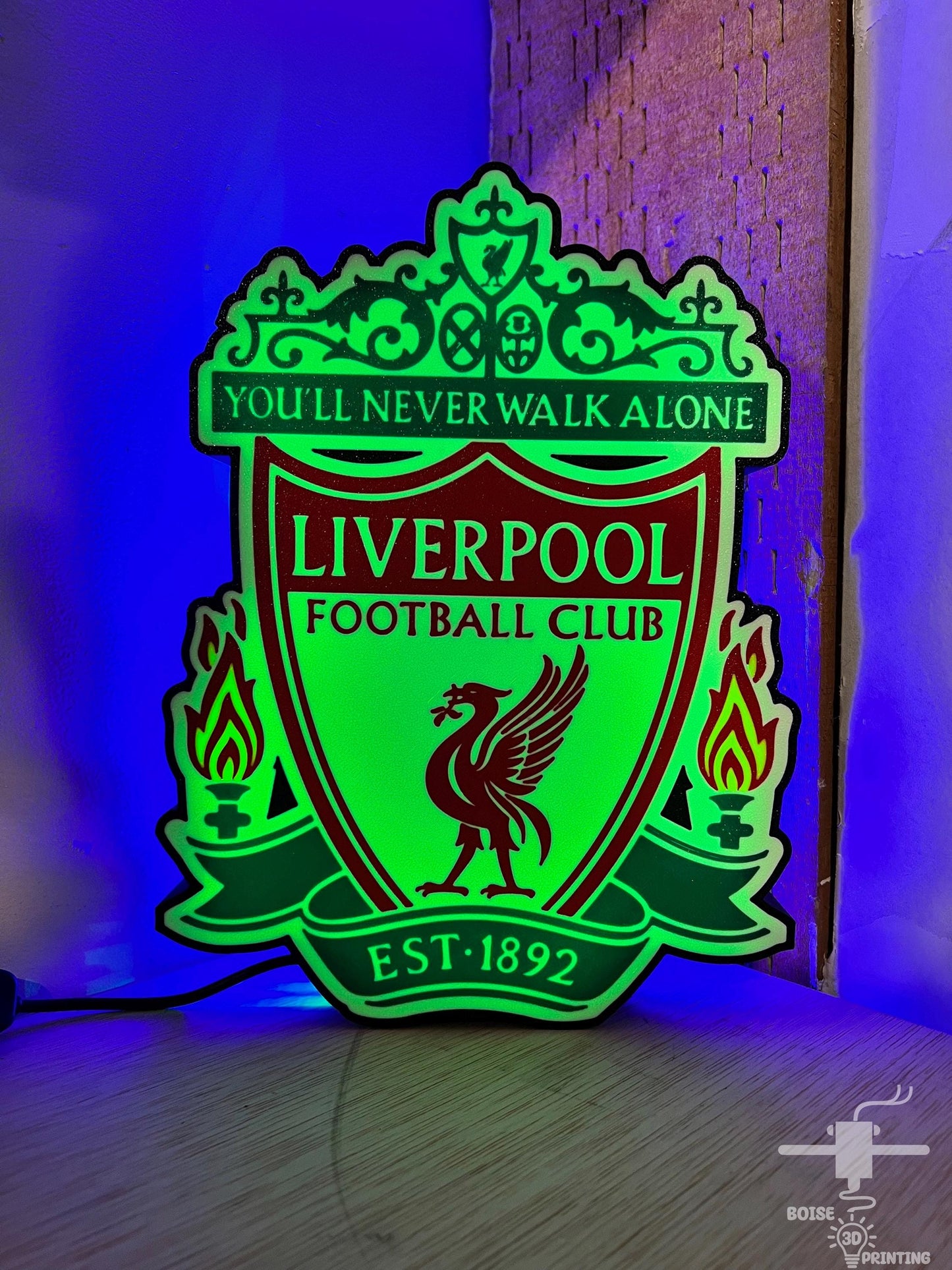 a neon green liverpool football club sign