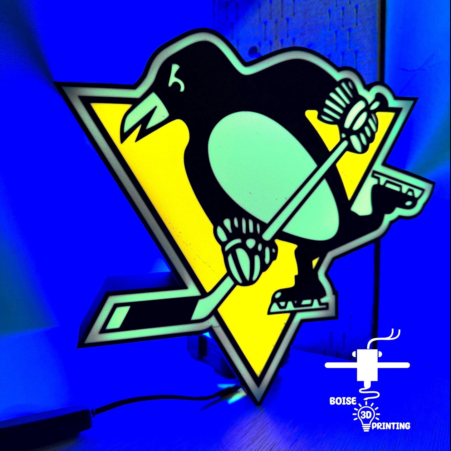 a picture of a penguin with a hockey sticker on it