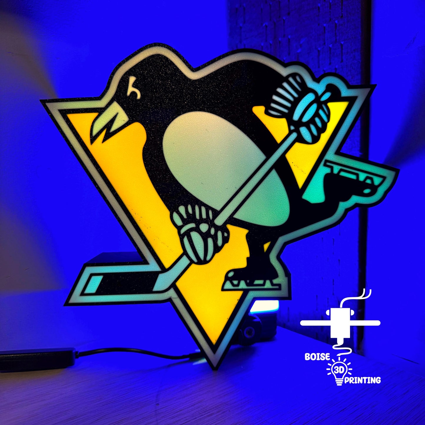 a penguin with a hockey sticker on it's back