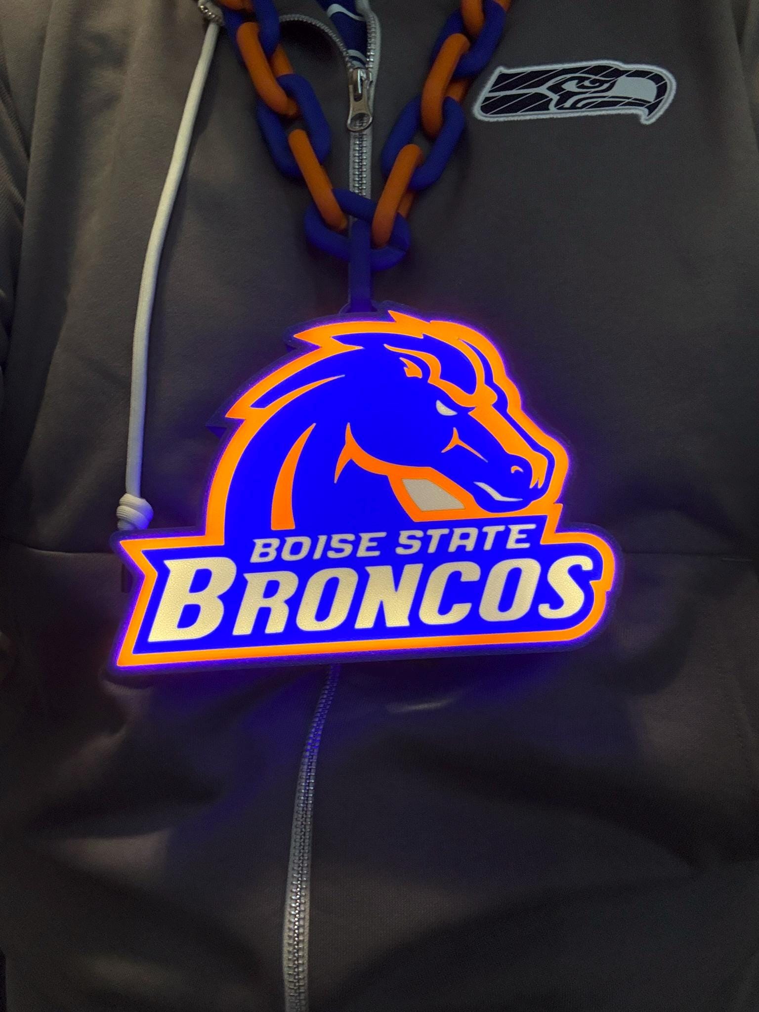 a close up of a hoodie with a horse on it