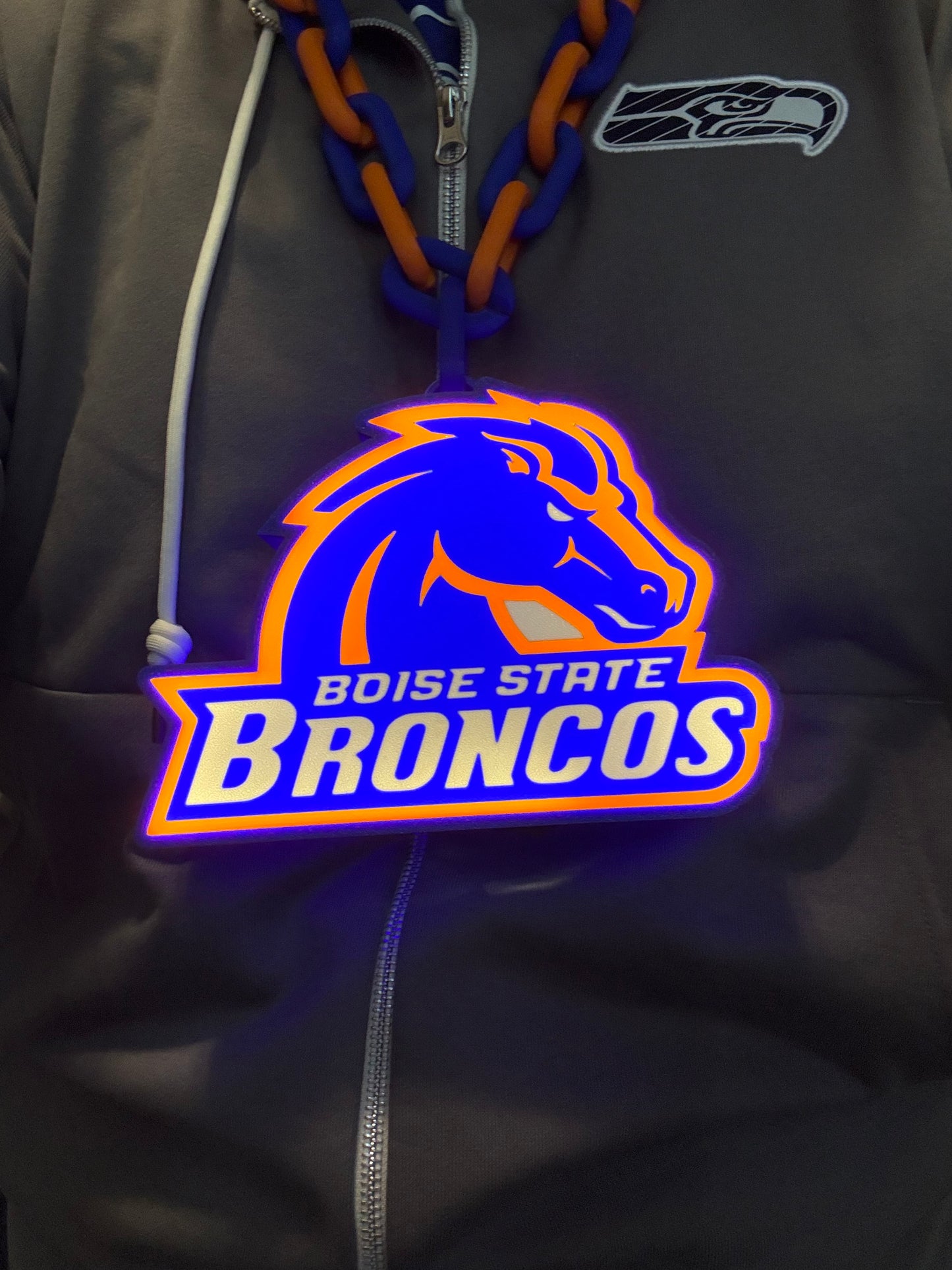 a blue and orange jacket with a logo on it