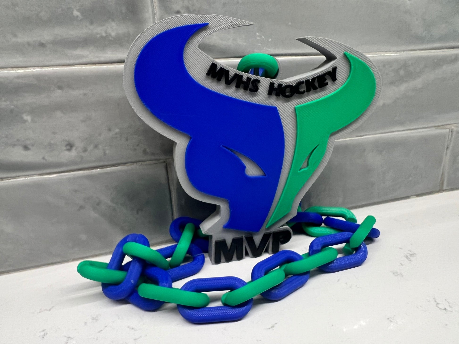 a close up of a sign on a chain