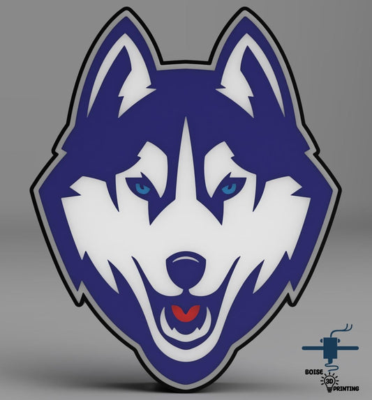 a blue and white wolf head with blue eyes