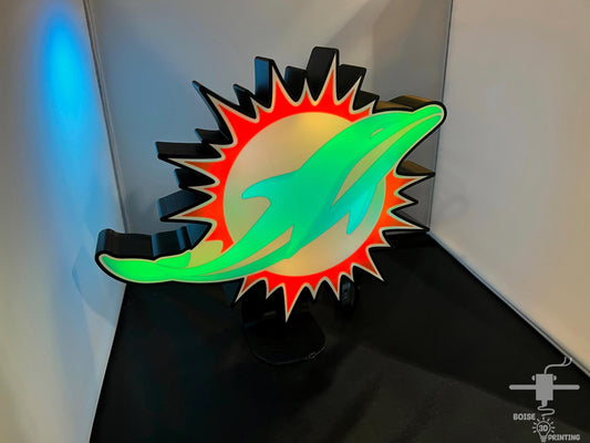 a picture of a green and orange object on a table