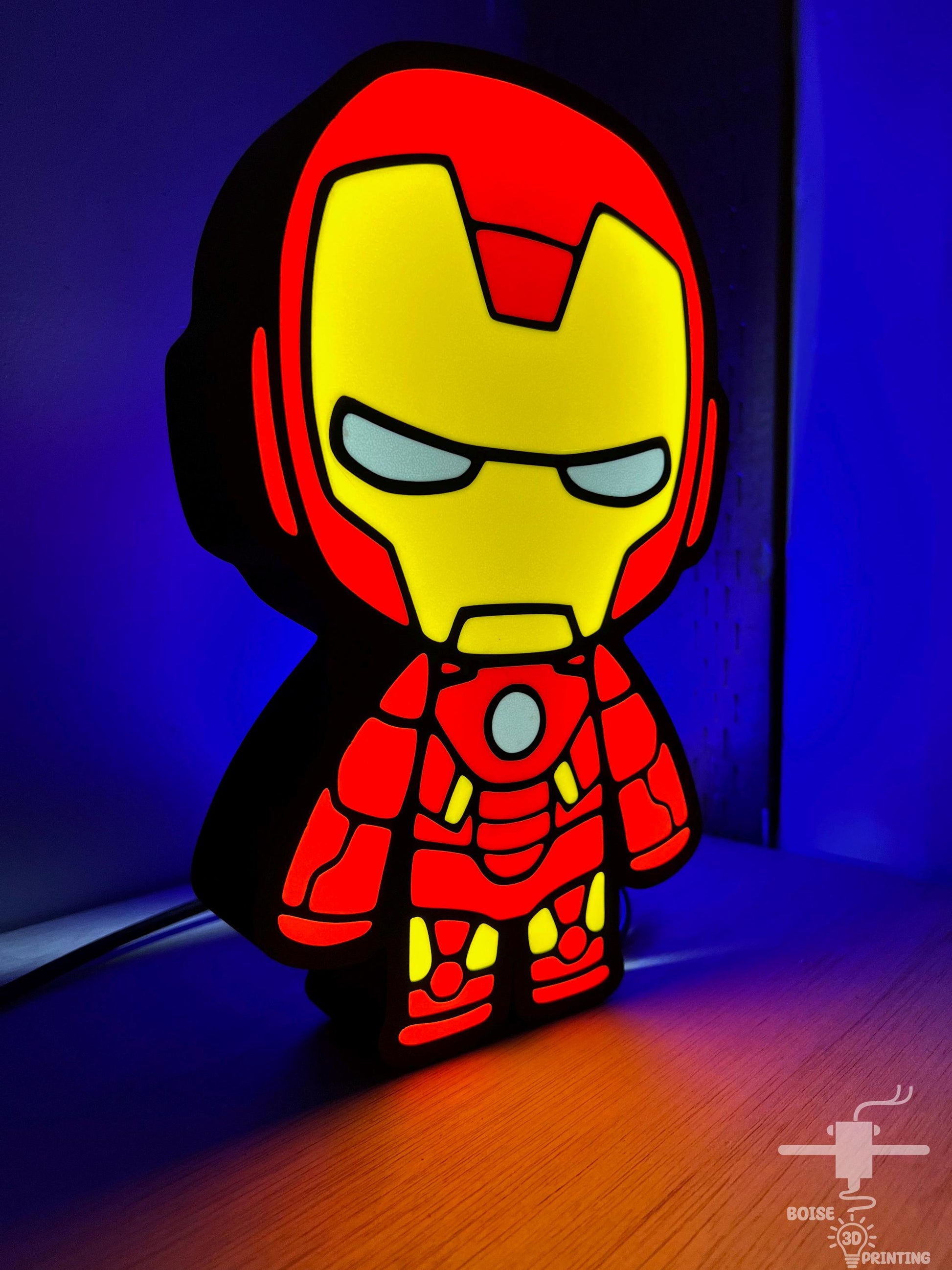 a paper cut out of iron man on a table