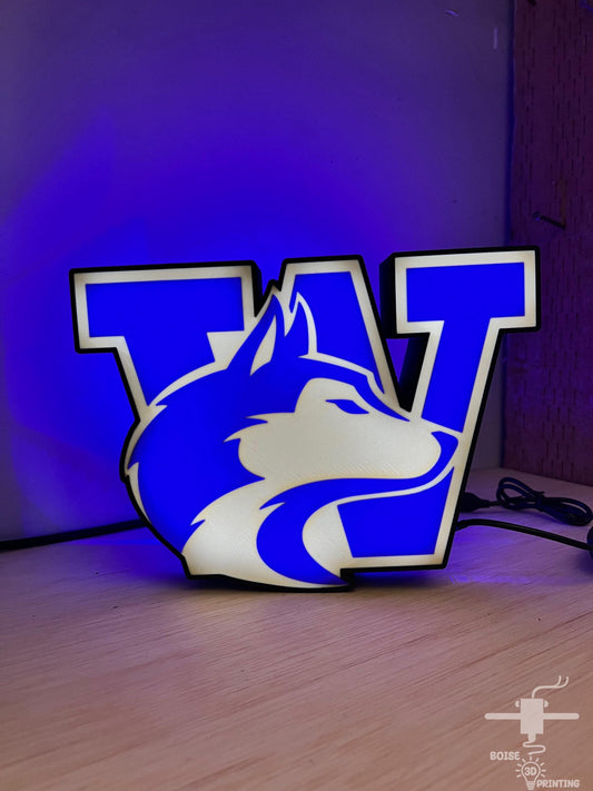 a blue and white lamp with a logo on it