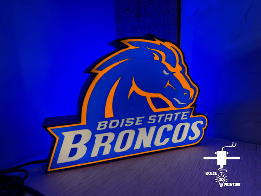 the boise state bronco's neon sign is lit up