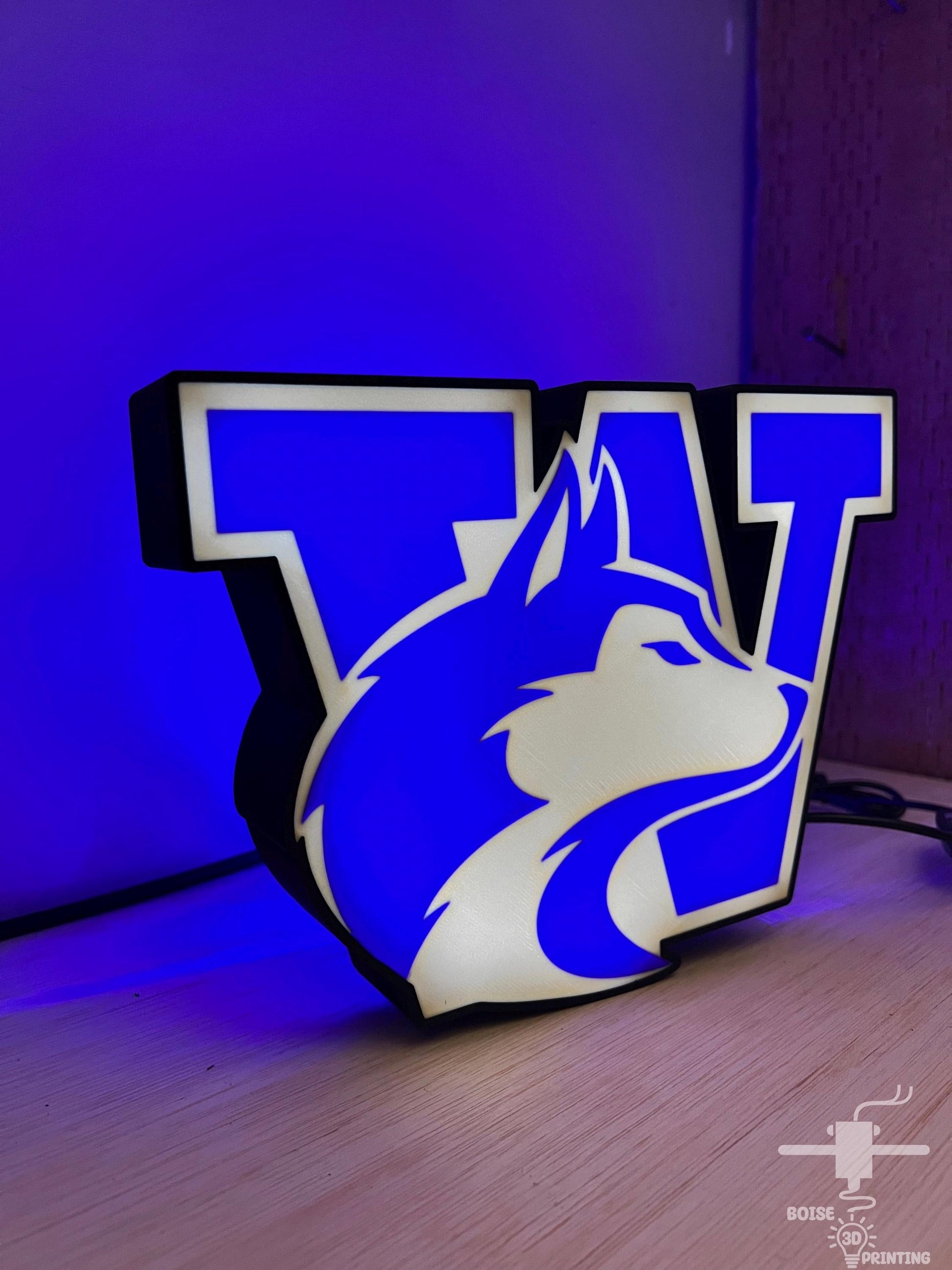 a blue and white lamp with a logo on it