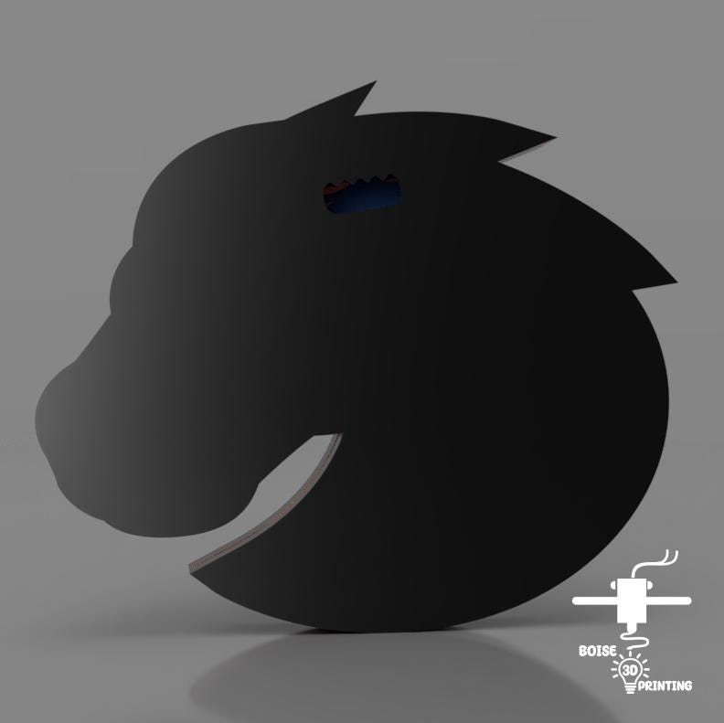 a black horse head with a red light on it